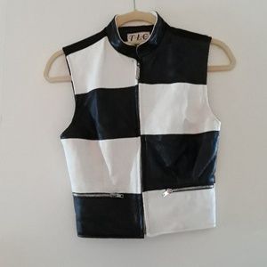 Black & white leather vest.